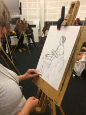 Mannelijk naaktmodel schilderen met collega's Hoogheemraadschap in Leiden bij het personeelsfeest